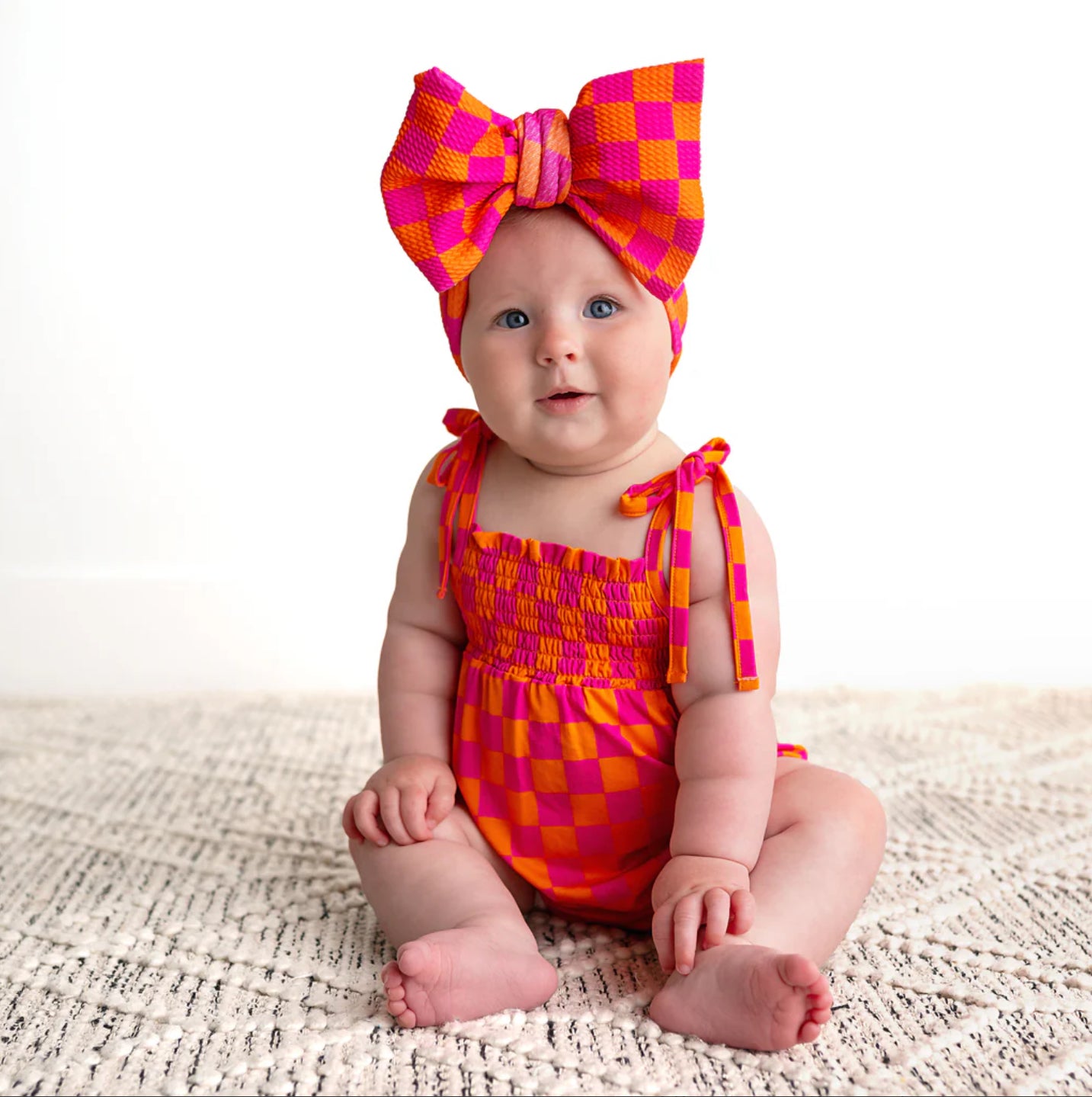 Eric Orange Smocked Bubble Romper
