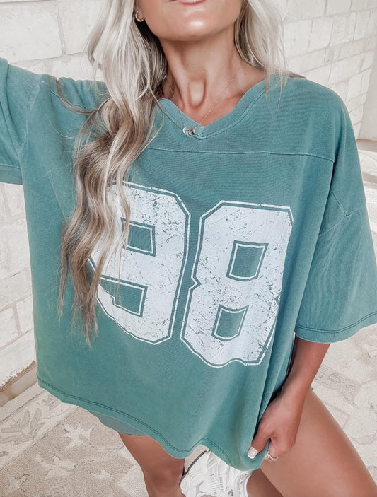 Oversized Varsity Style V-Neck Graphic T-Shirt
